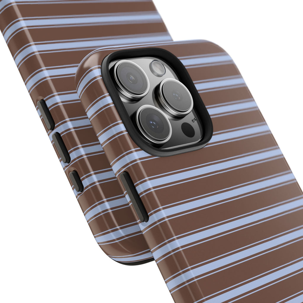 Angled view of brown blue-and-white striped phone case with raised camera lenses and side buttons