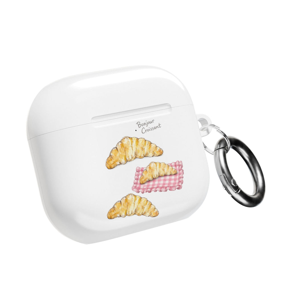 White AirPods case with croissant and pink checker graphic and metal keyring loop
