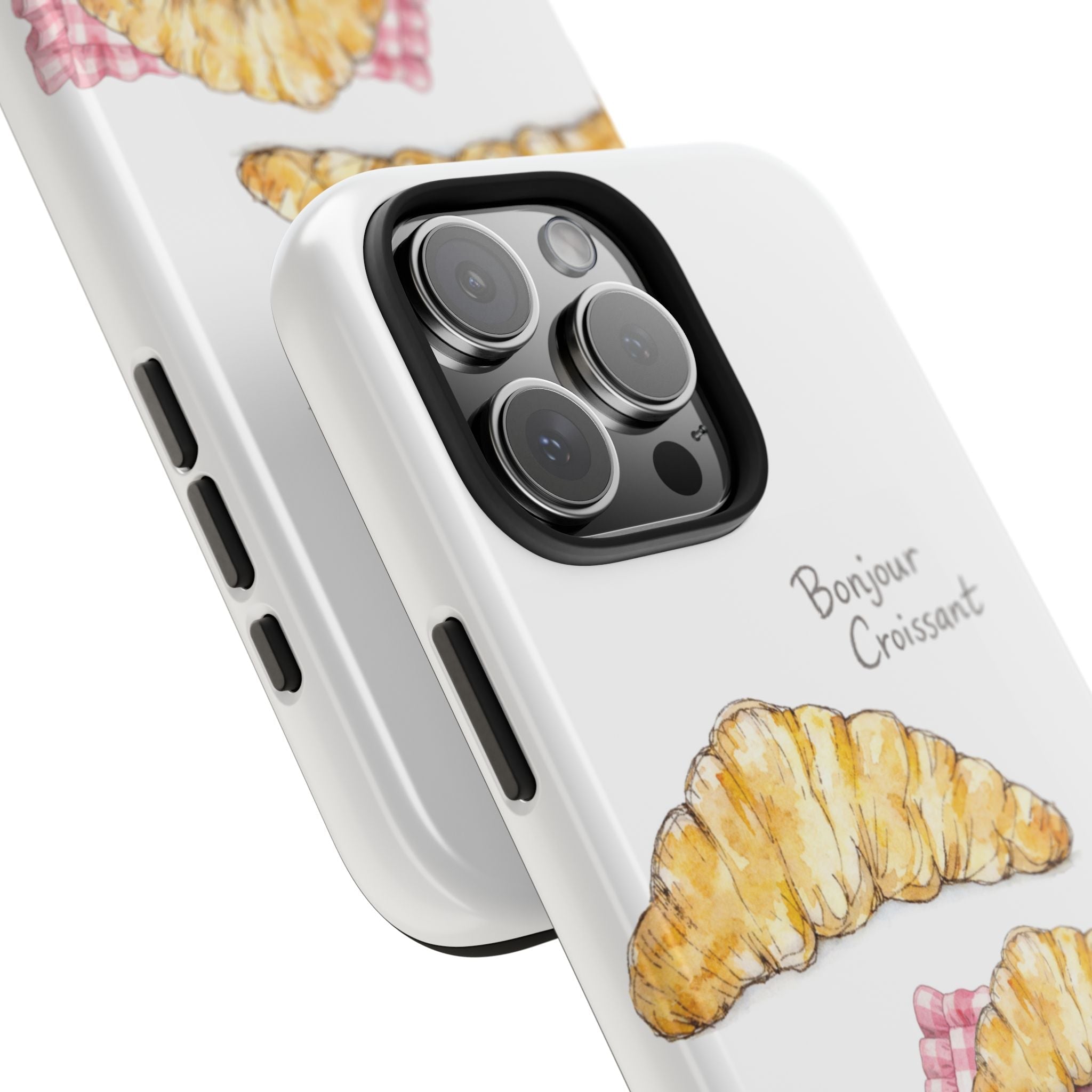 Angled view of white phone case with croissant graphic near camera cutout