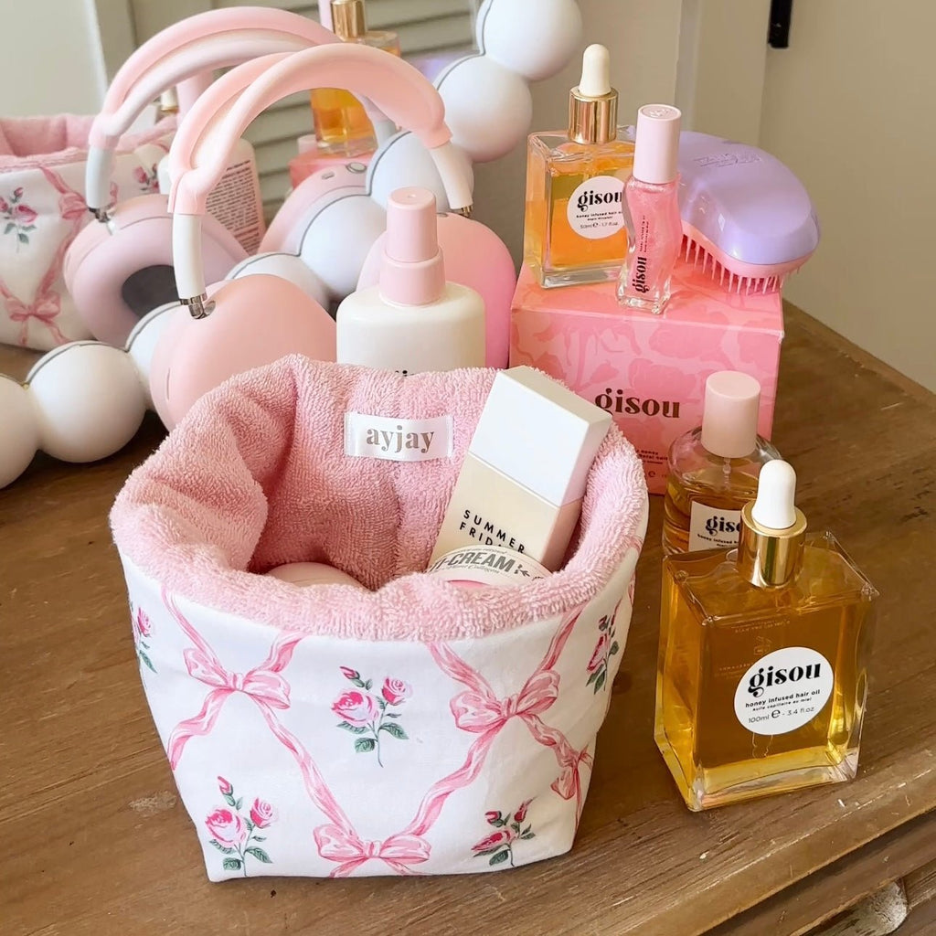 Pink floral organizer with soft pink interior and white fabric bin for storage