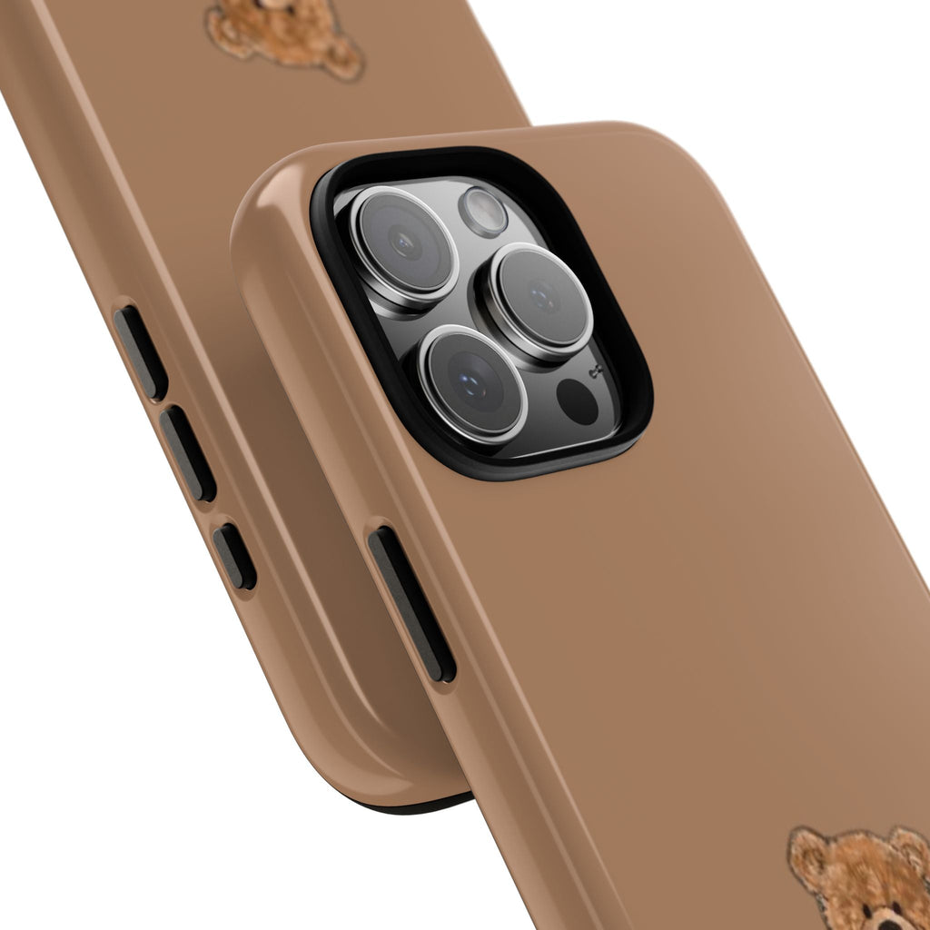 Close view of brown teddy bear phone case edge and camera cutouts
