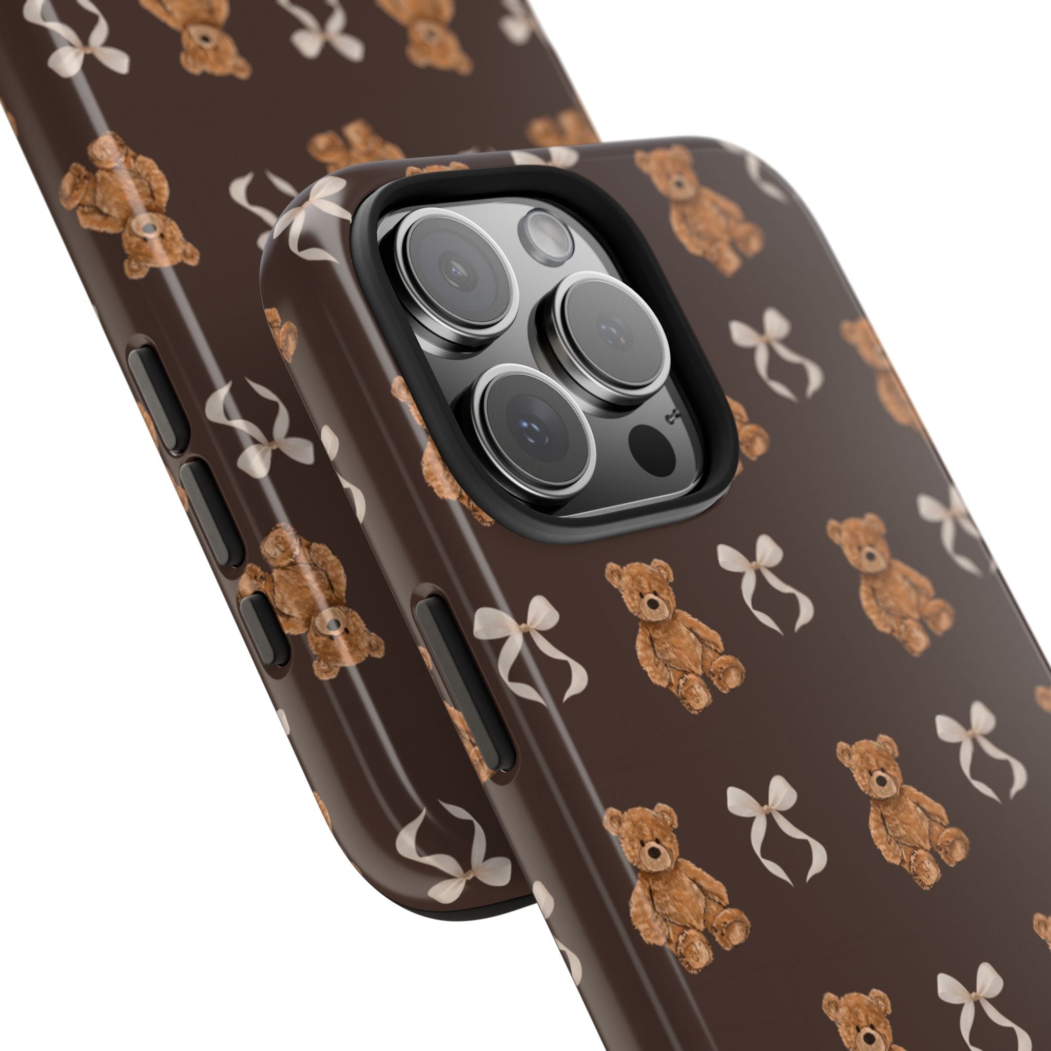 Side view brown phone case with teddy bear and bow print, raised camera lenses