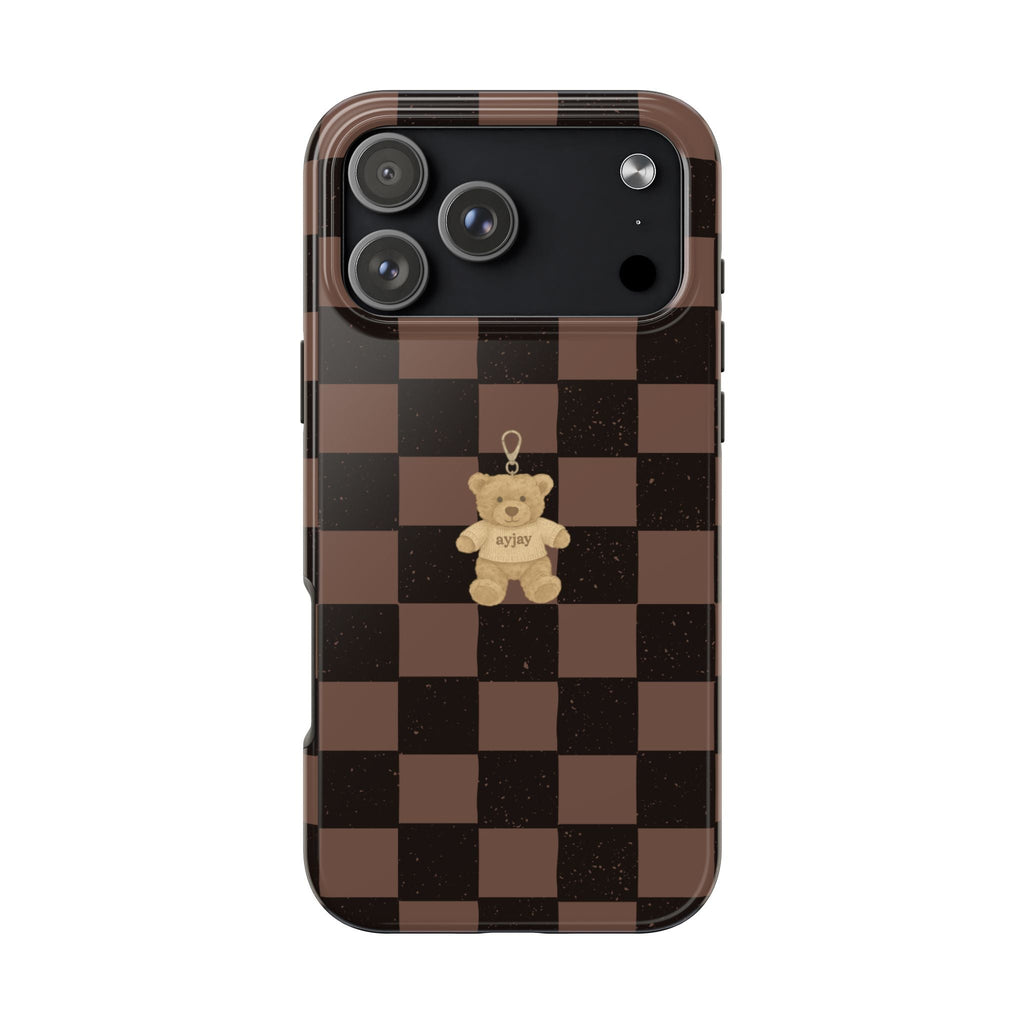 Brown checkered phone case with small teddy bear graphic centered, cutout for cameras