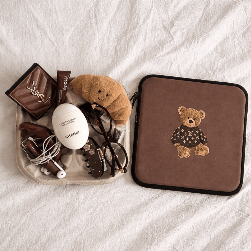 Brown teddy bear sleeve with logo sweater patch and black zipper trim