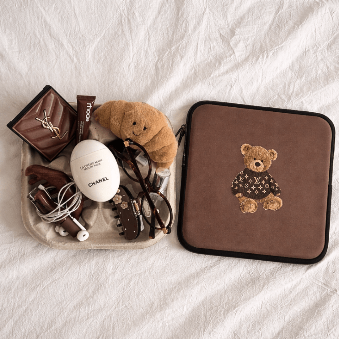 Brown teddy bear sleeve with logo sweater patch and black zipper trim