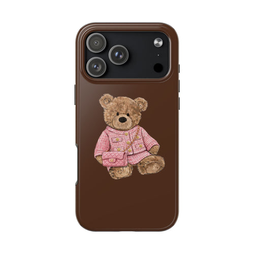 Brown phone case with teddy bear in pink tweed outfit, teddy holding small purse