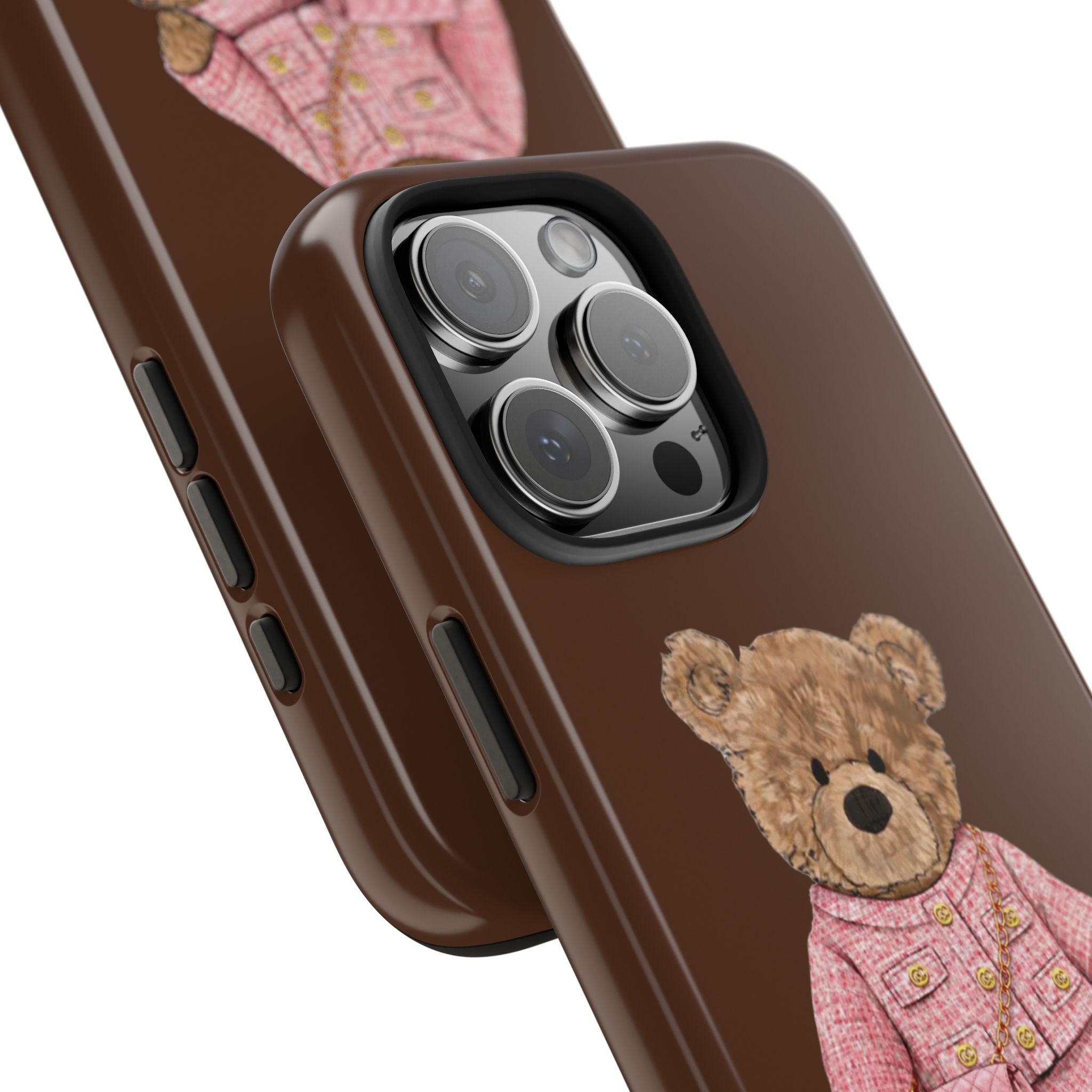 Brown phone case angled; teddy bear in pink tweed suit near camera cutouts
