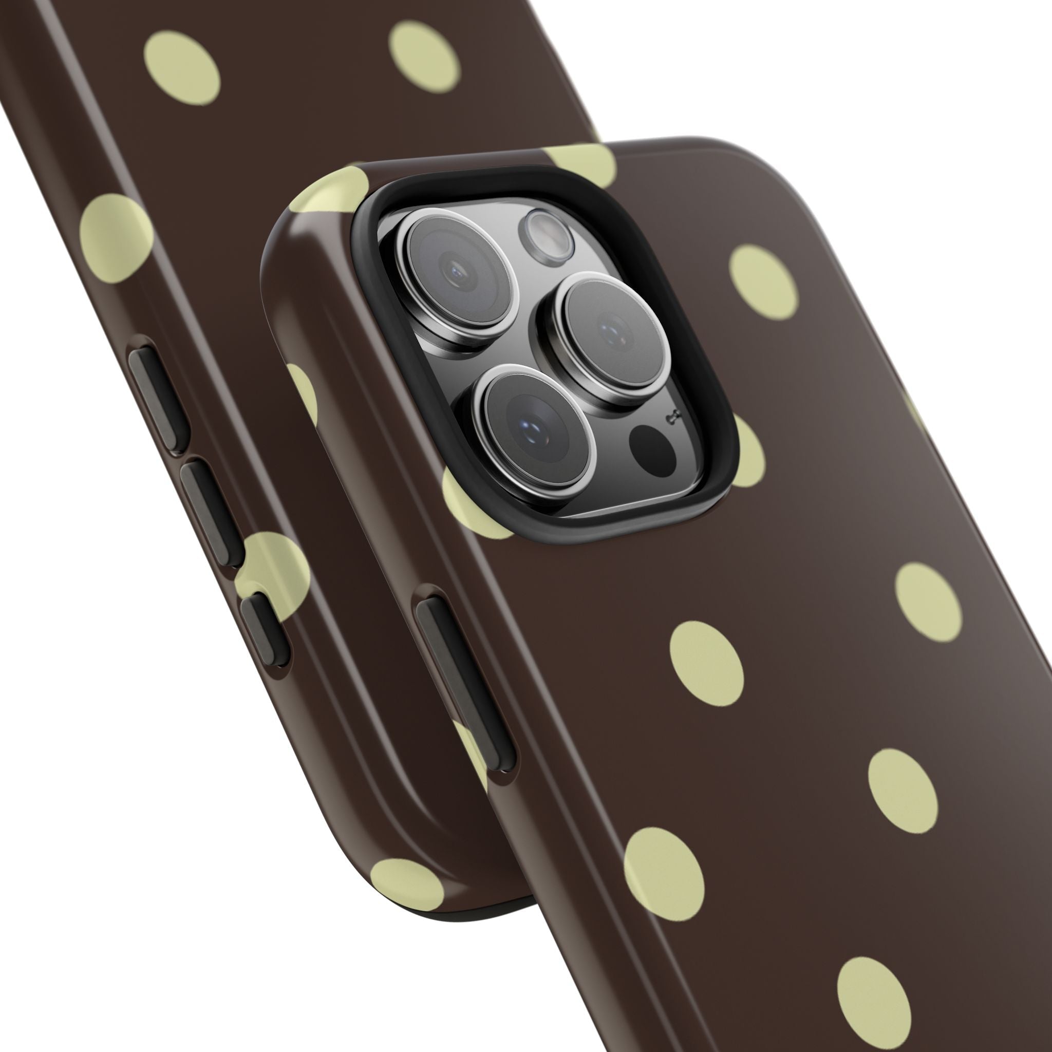 Brown polka dot phone case in diagonal view, raised camera rings visible