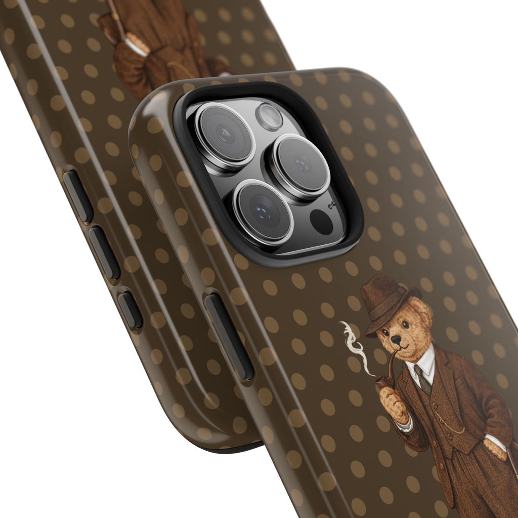 Brown polka dot phone case with teddy bear gentleman beside camera cutout, angled
