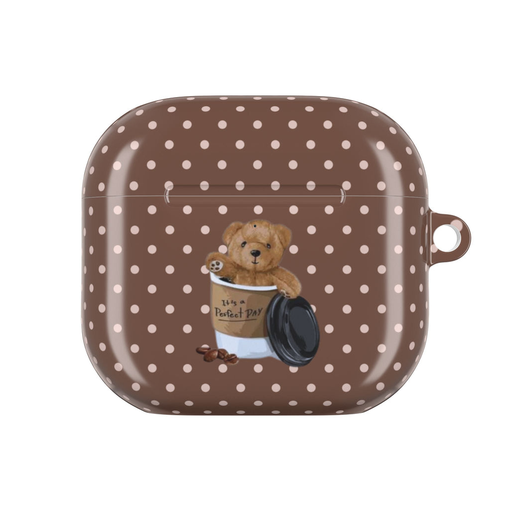 Brown polka-dot AirPods case with teddy bear cup design on closed shell