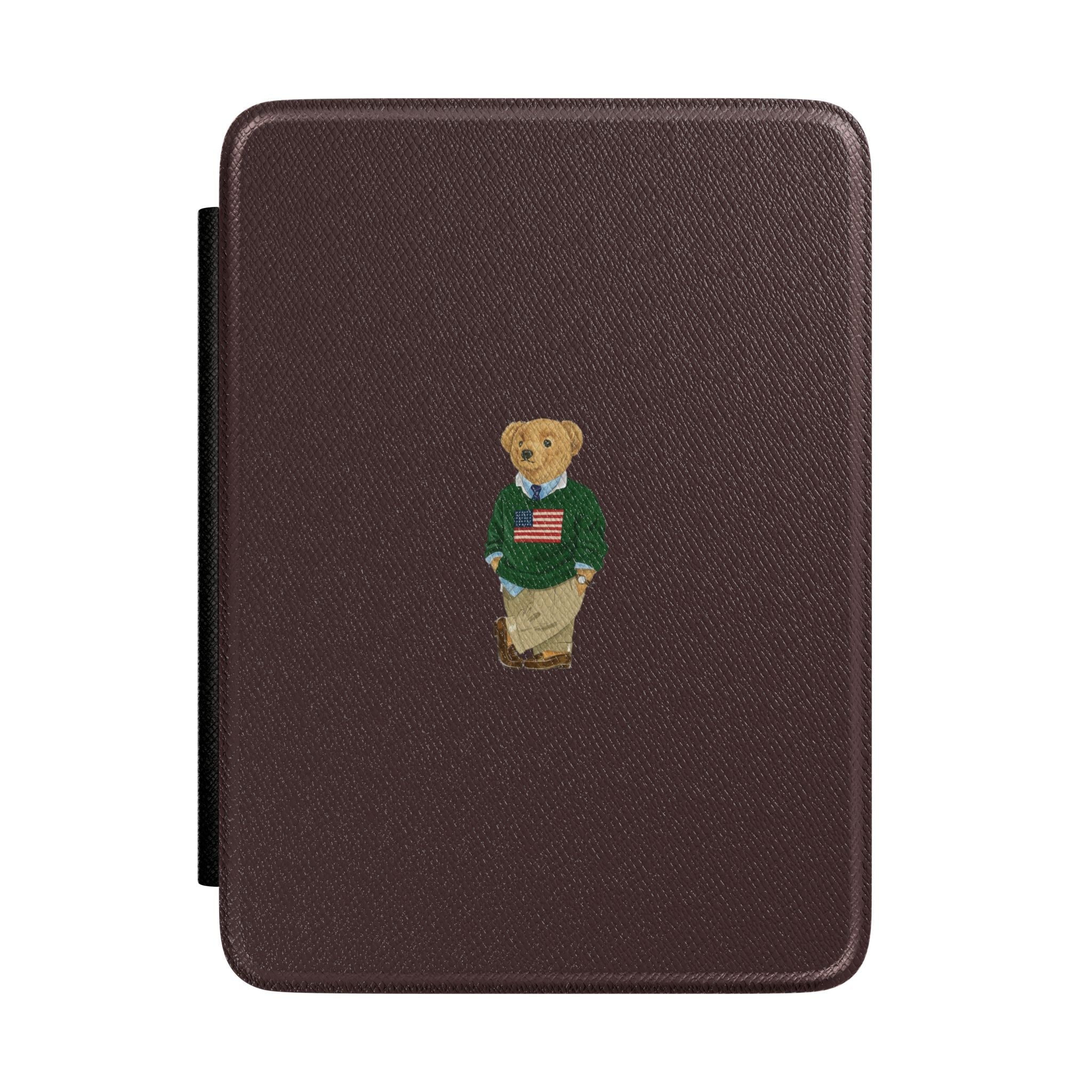 Brown hardcover Kindle case with teddy bear emblem and side stand