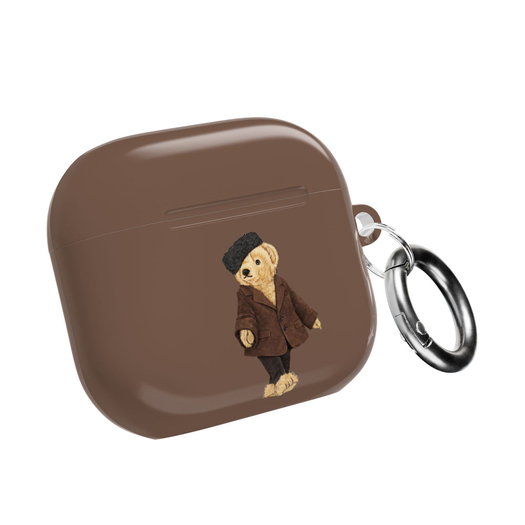Brown AirPods case closed with teddy bear applique and top charging opening