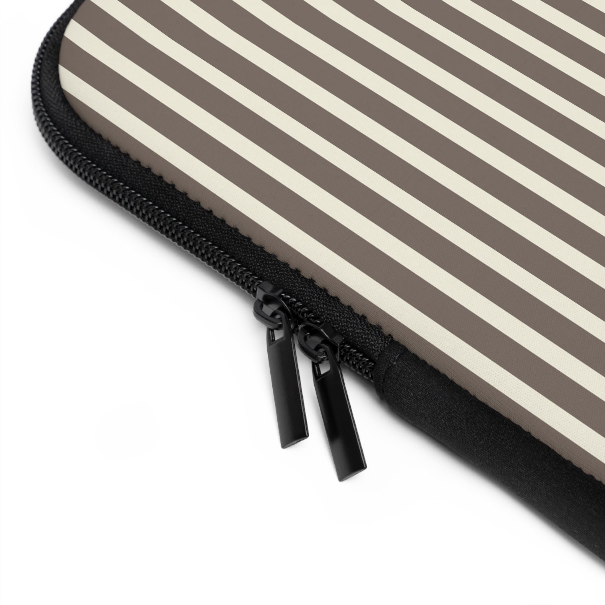 Close-up of black zipper on brown and cream striped neoprene sleeve