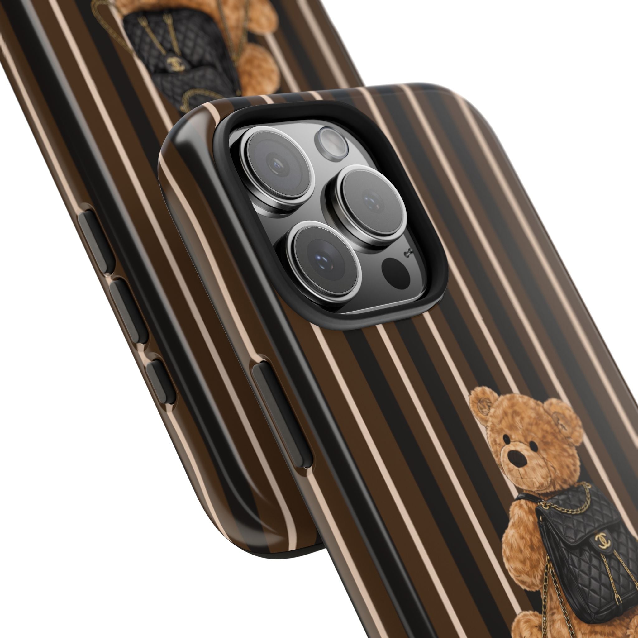 Brown striped phone case angled view with teddy bear backpack near camera cutouts