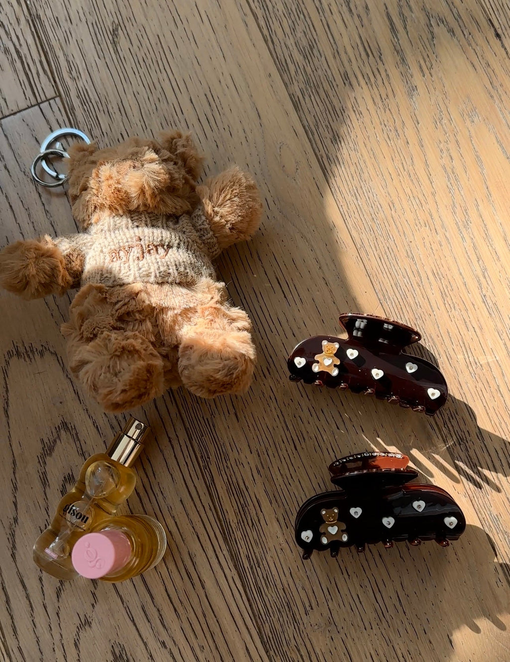 Dark brown teddy bear hair claw clip with heart rhinestones and glossy top loop