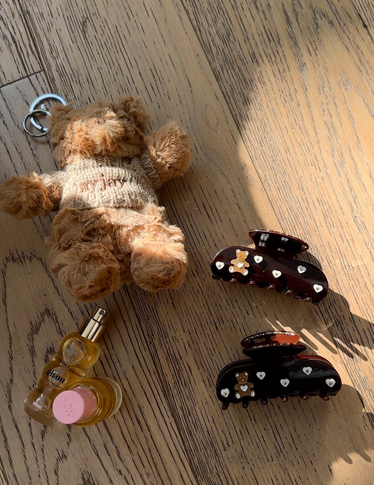 Dark brown teddy bear hair claw clip with heart rhinestones and glossy top loop