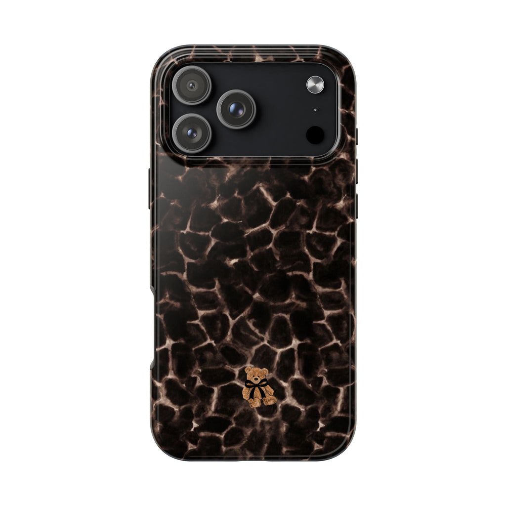 Brown tortoise shell teddy bear phone case with small bear emblem, glossy finish look