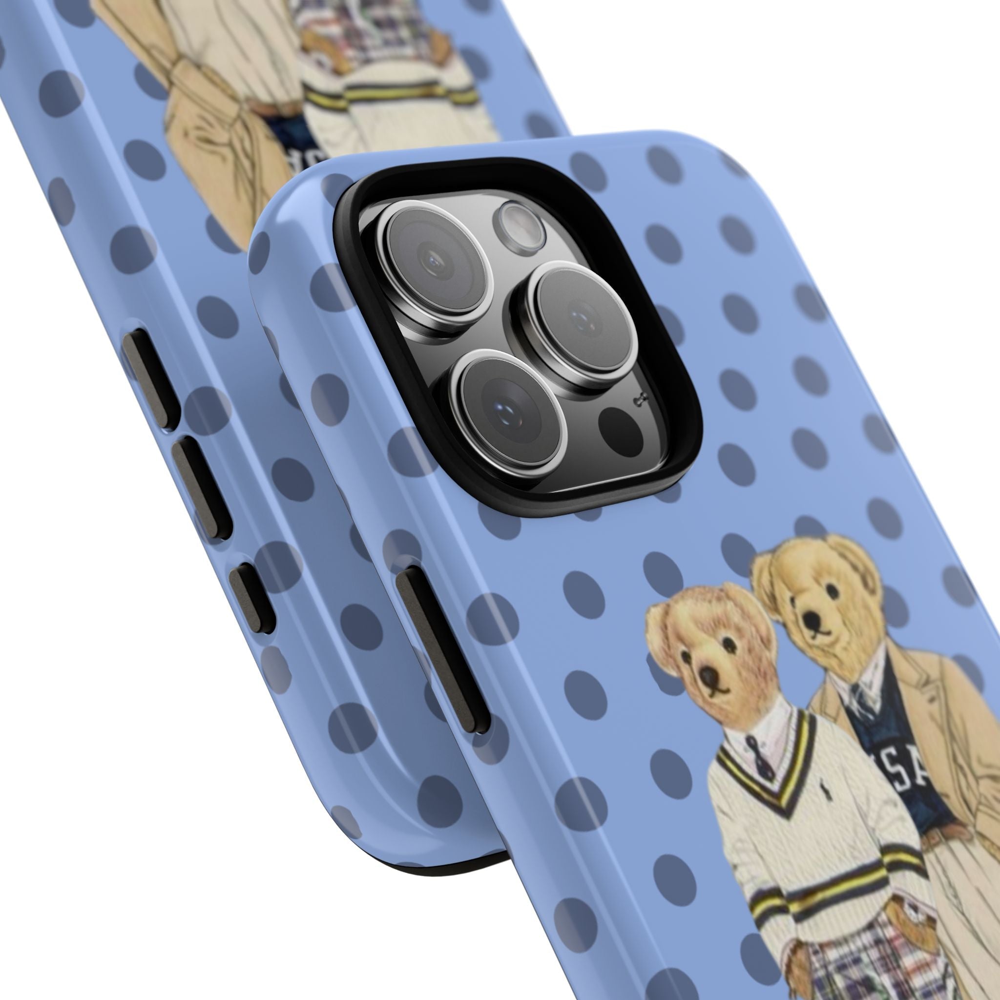 Angled view of light blue polka dot phone case with teddy bear characters near camera