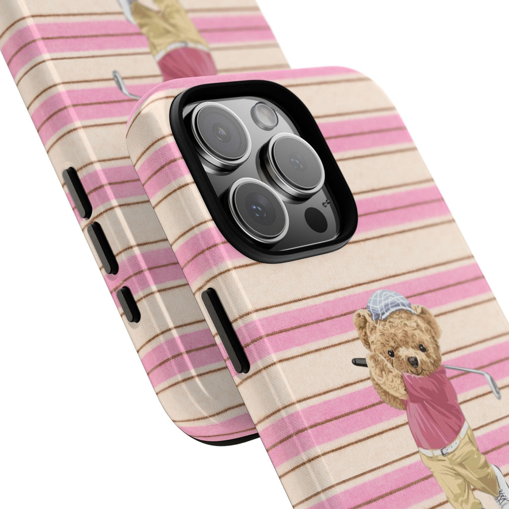 Angle view of pink/cream striped phone case with teddy bear golfer figure