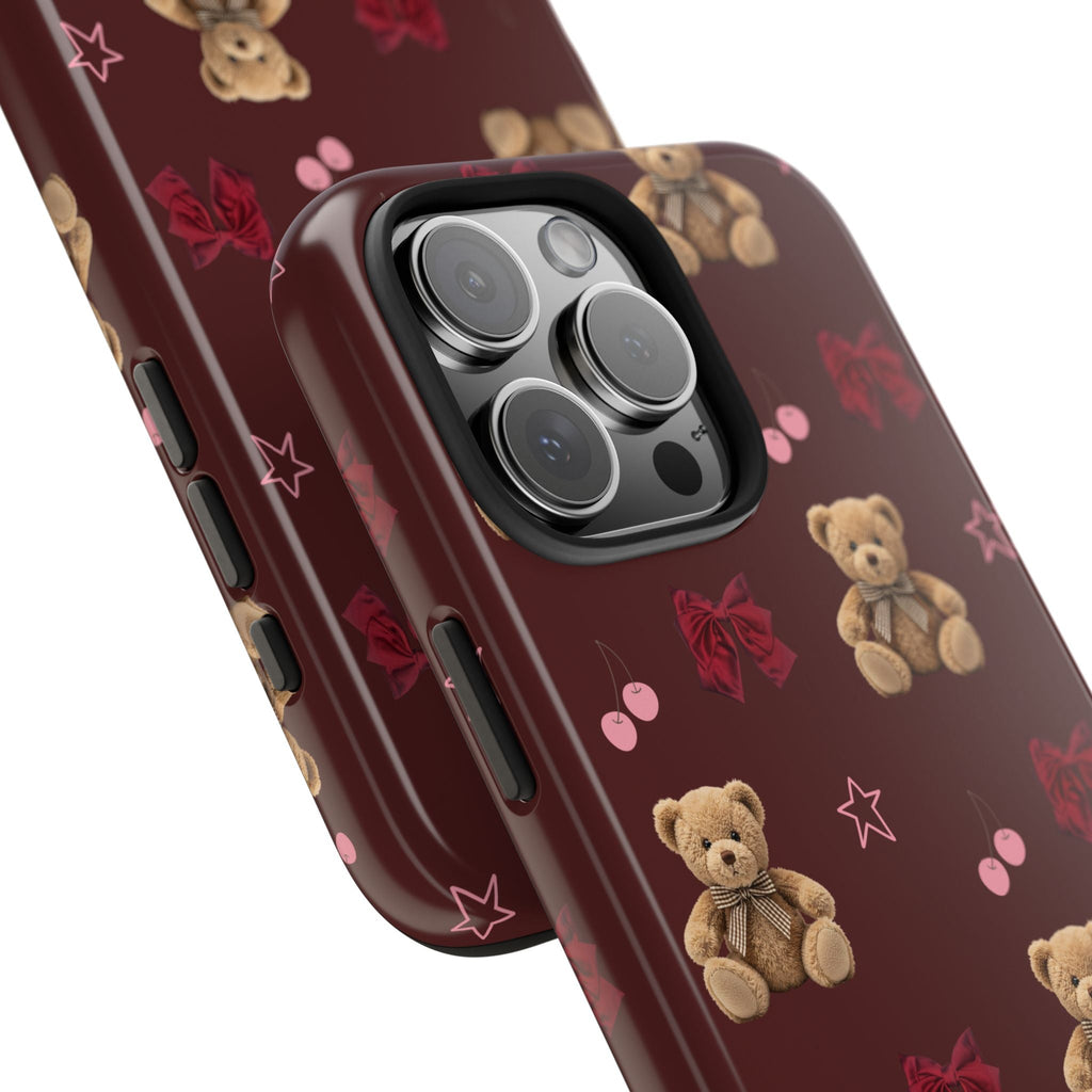 Close-up burgundy teddy bear phone case with camera cutout and side button openings