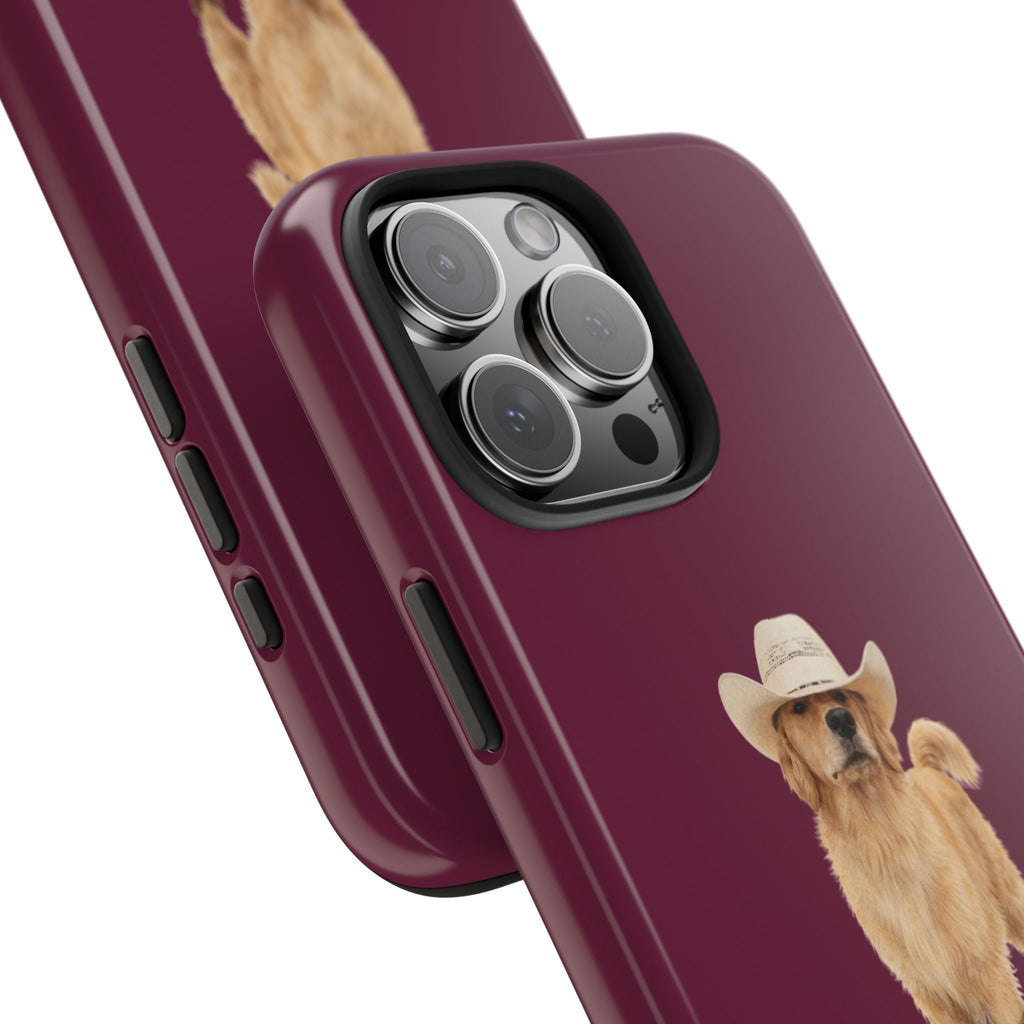 Angled burgundy phone case with cowboy golden retriever dog graphic near side buttons