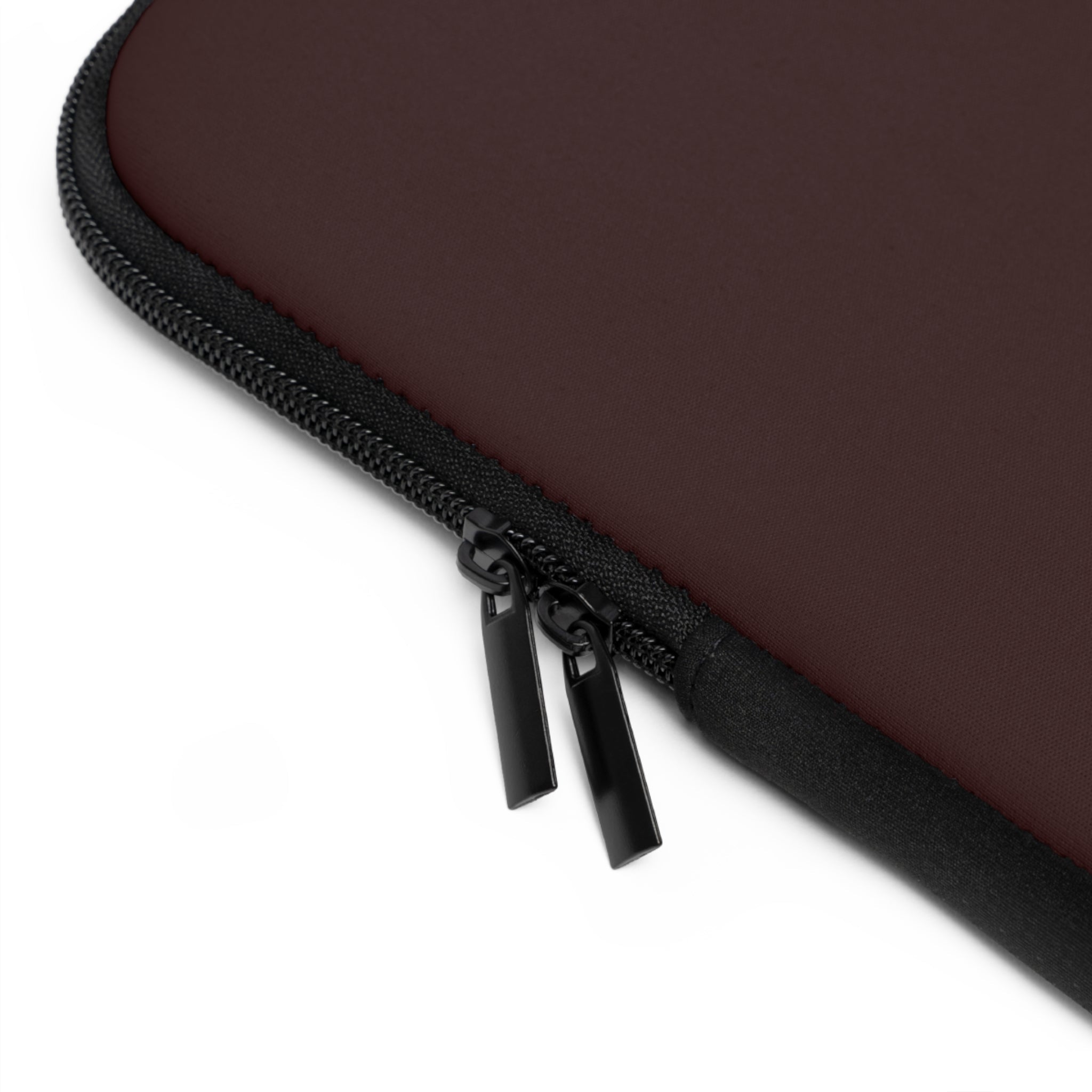 Burgundy neoprene sleeve edge with black zipper pull and protective seam trim