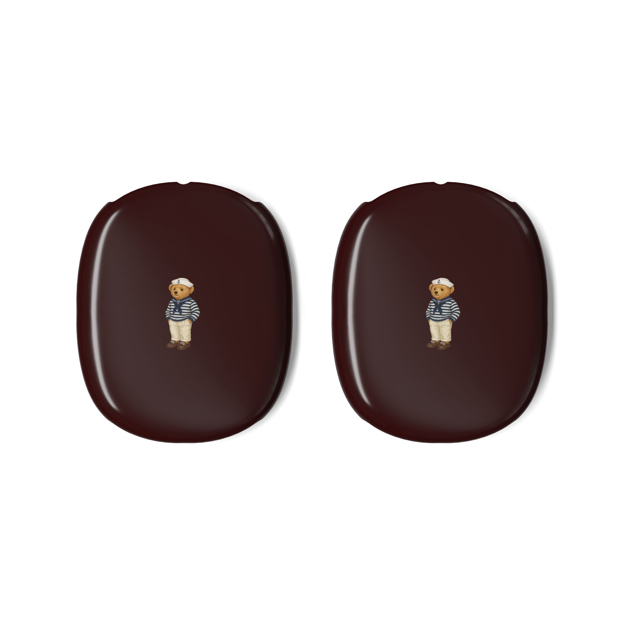 Pair of burgundy AirPods Max ear cup covers with sailor teddy bear emblem, oval shape