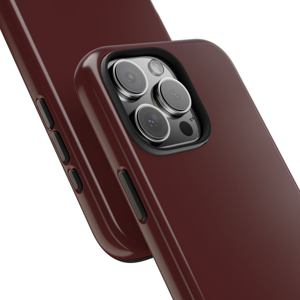 Burgundy phone case showing side buttons and triple camera cutout, glossy finish