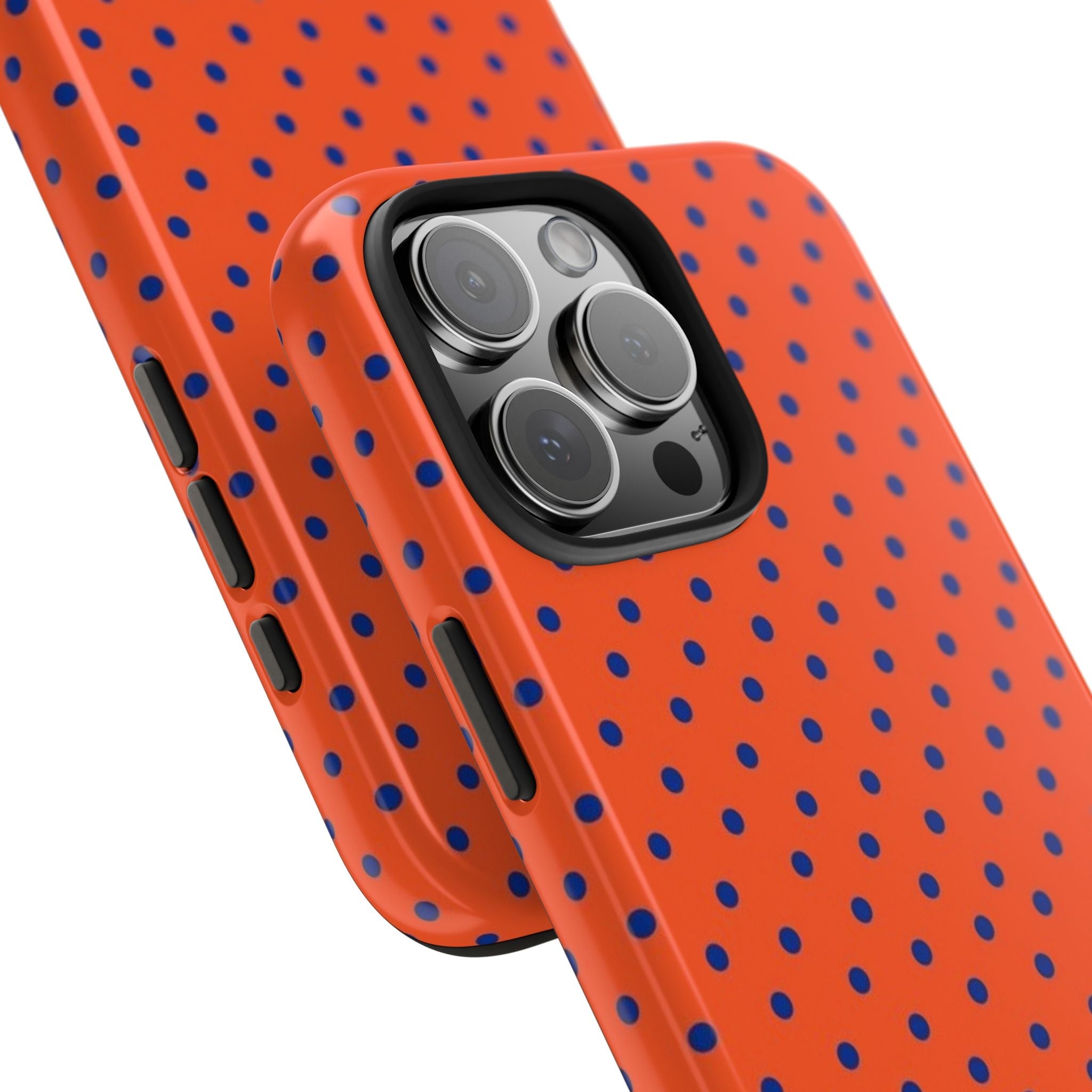 Side view of burnt orange phone case with navy mini polka dots; camera and side buttons