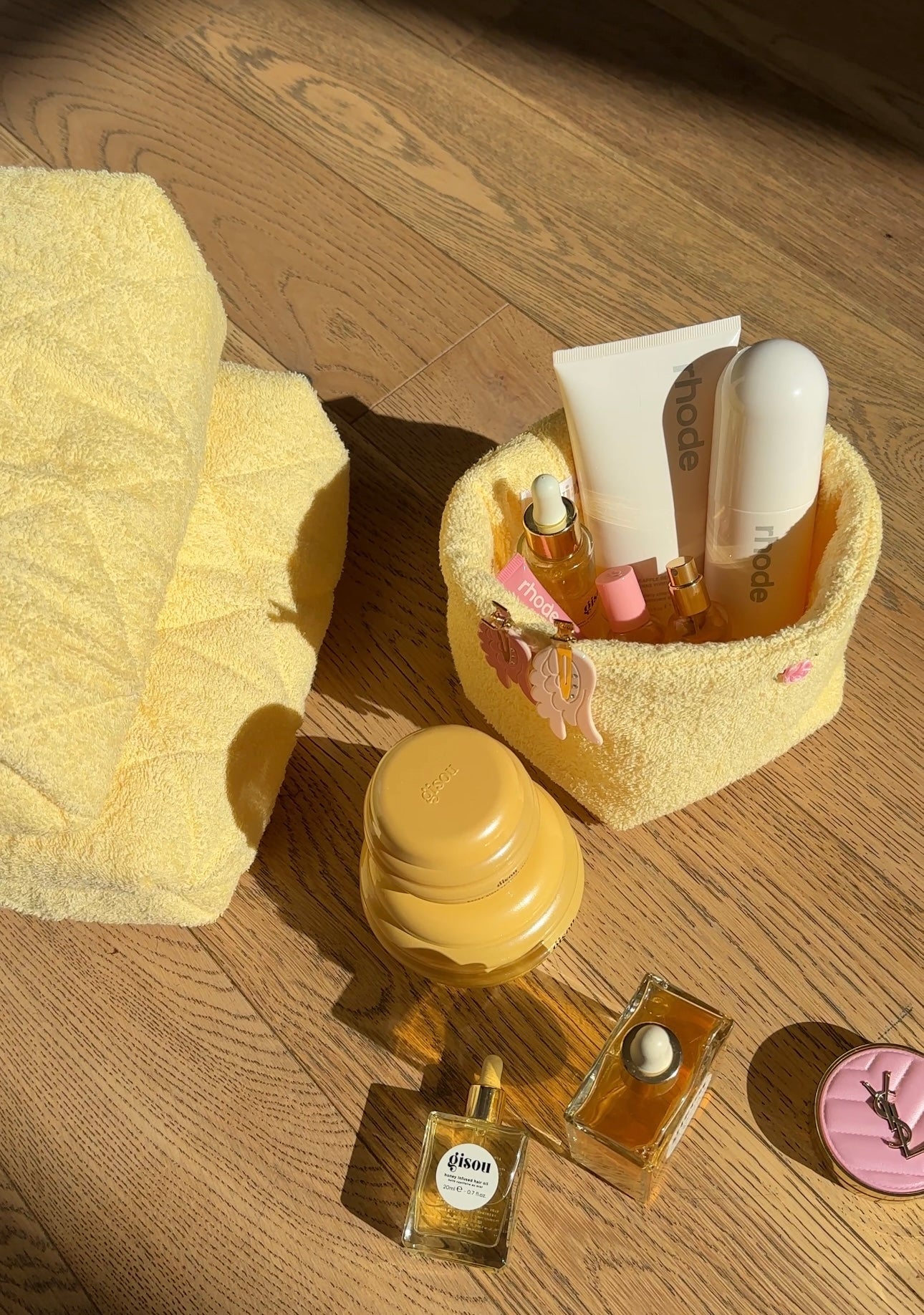 Butter yellow terrycloth organizer basket with side appliques and toiletries set
