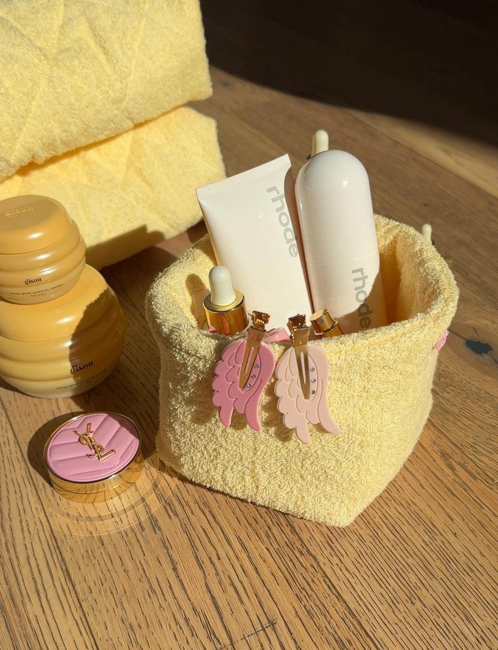 Butter yellow terrycloth organizer caddy with pink and white hanging charms