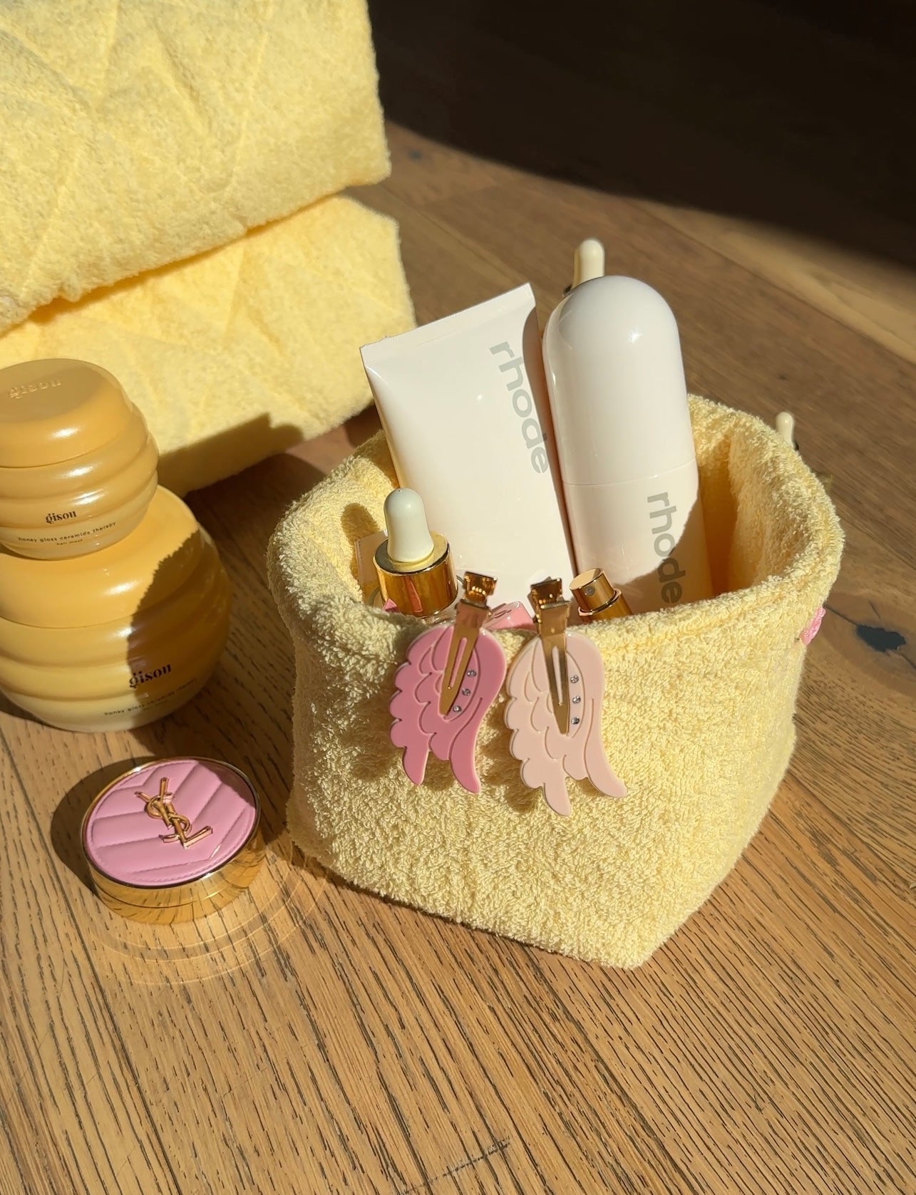 Butter yellow terrycloth organizer caddy with pink and white hanging charms