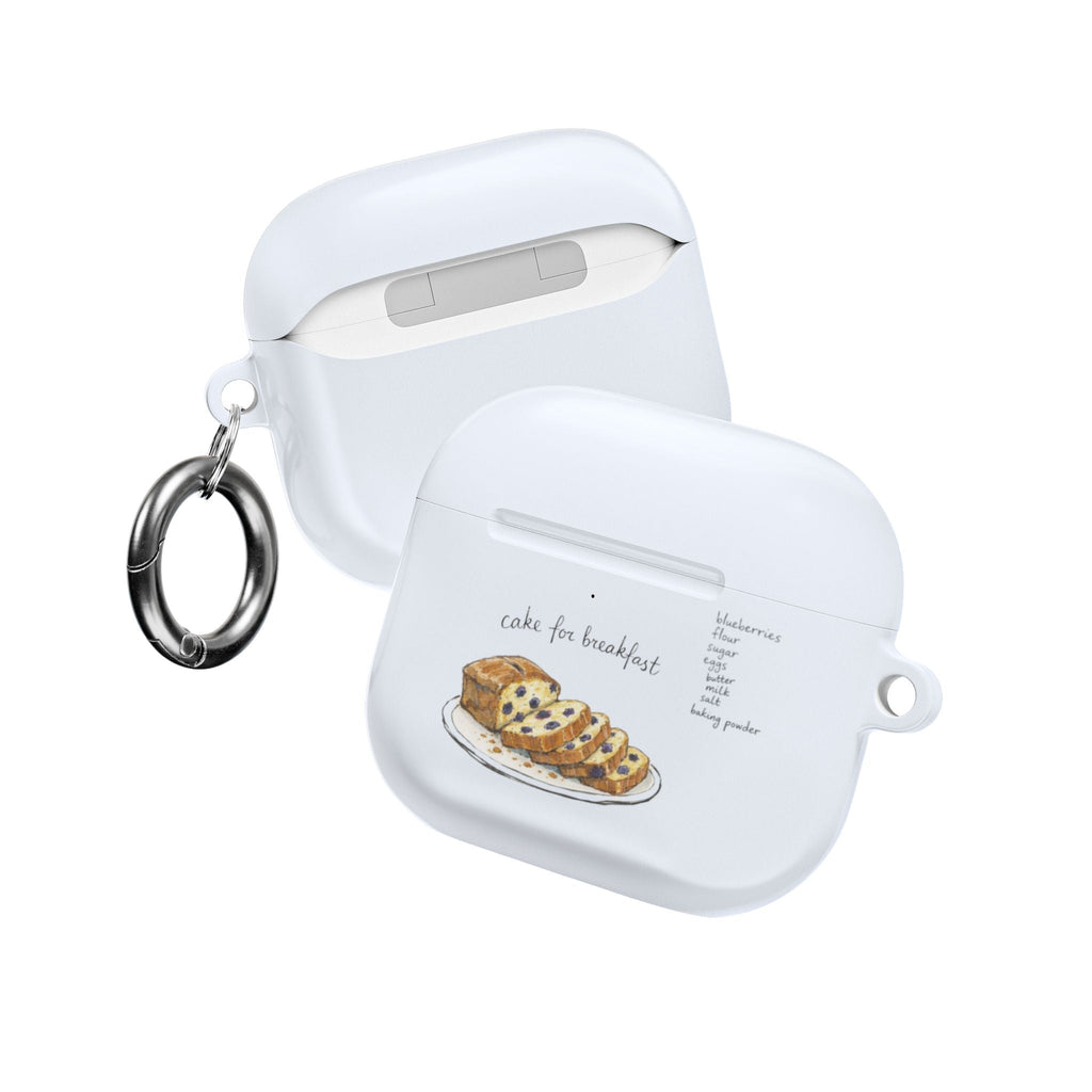 White AirPods case with protective cover and cake graphic; metal key ring attached
