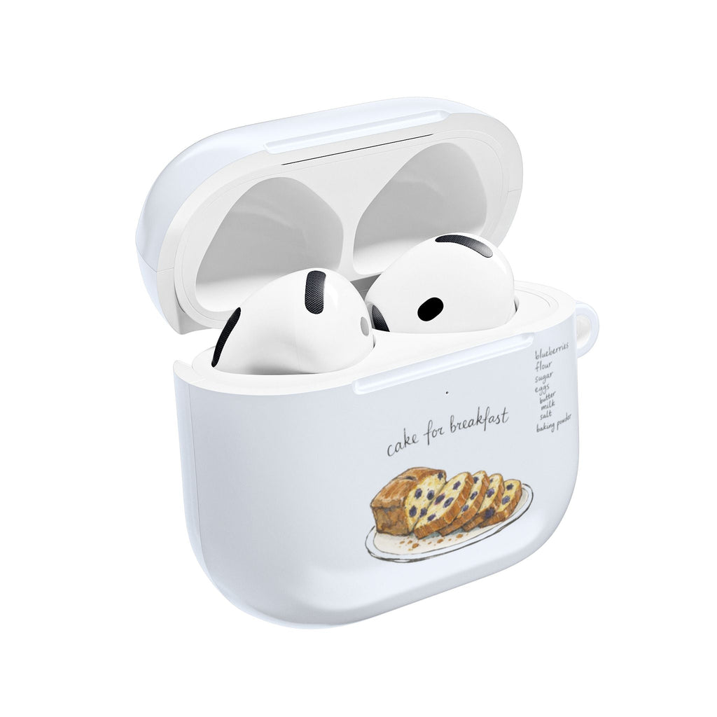 White AirPods case with lid open; black-and-white earbuds and cake illustration on front