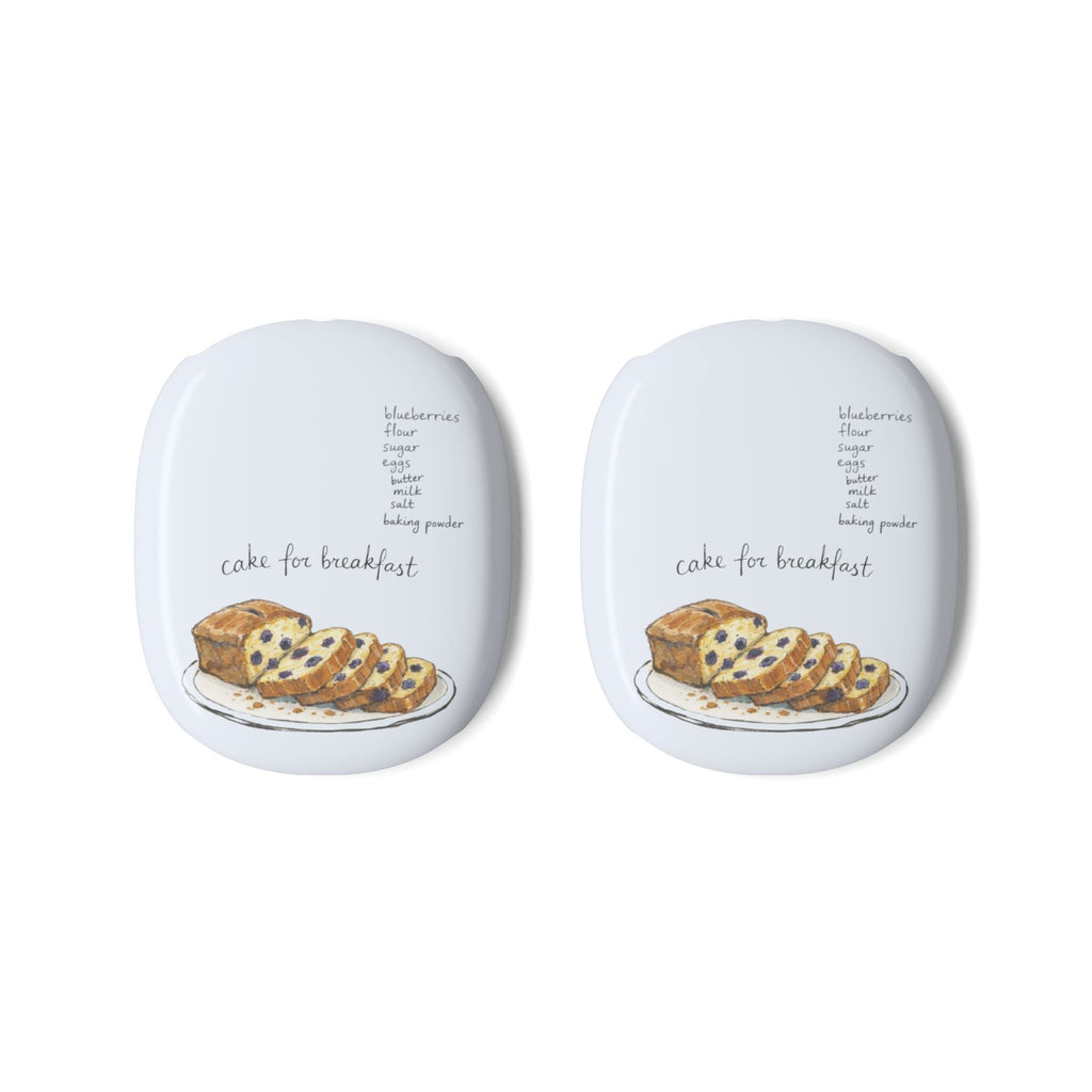 Two white AirPods Max case covers, each with “cake for breakfast” cake graphic