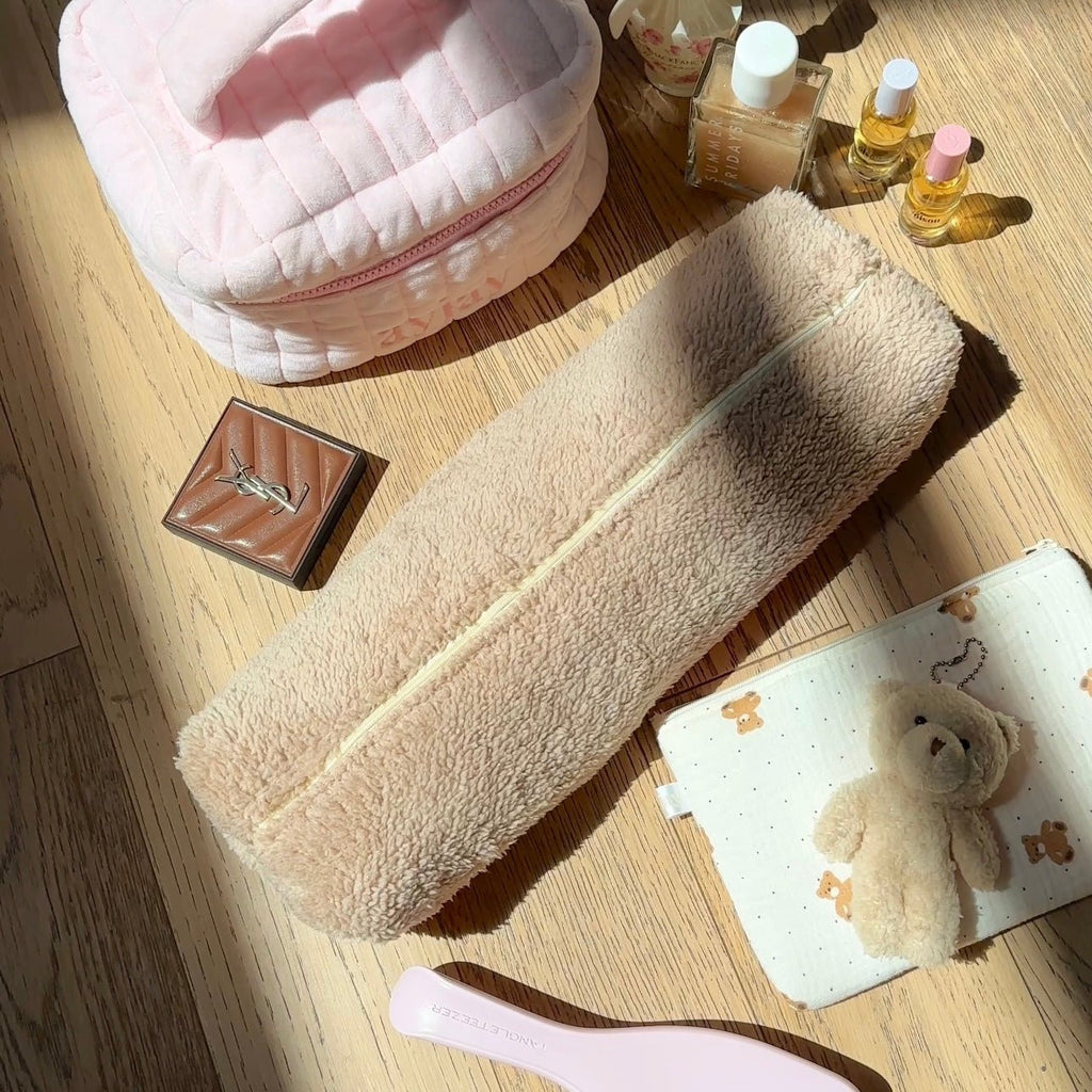 Camel sherpa storage pouch with zip edge, plus small white teddy pouch with bear prints