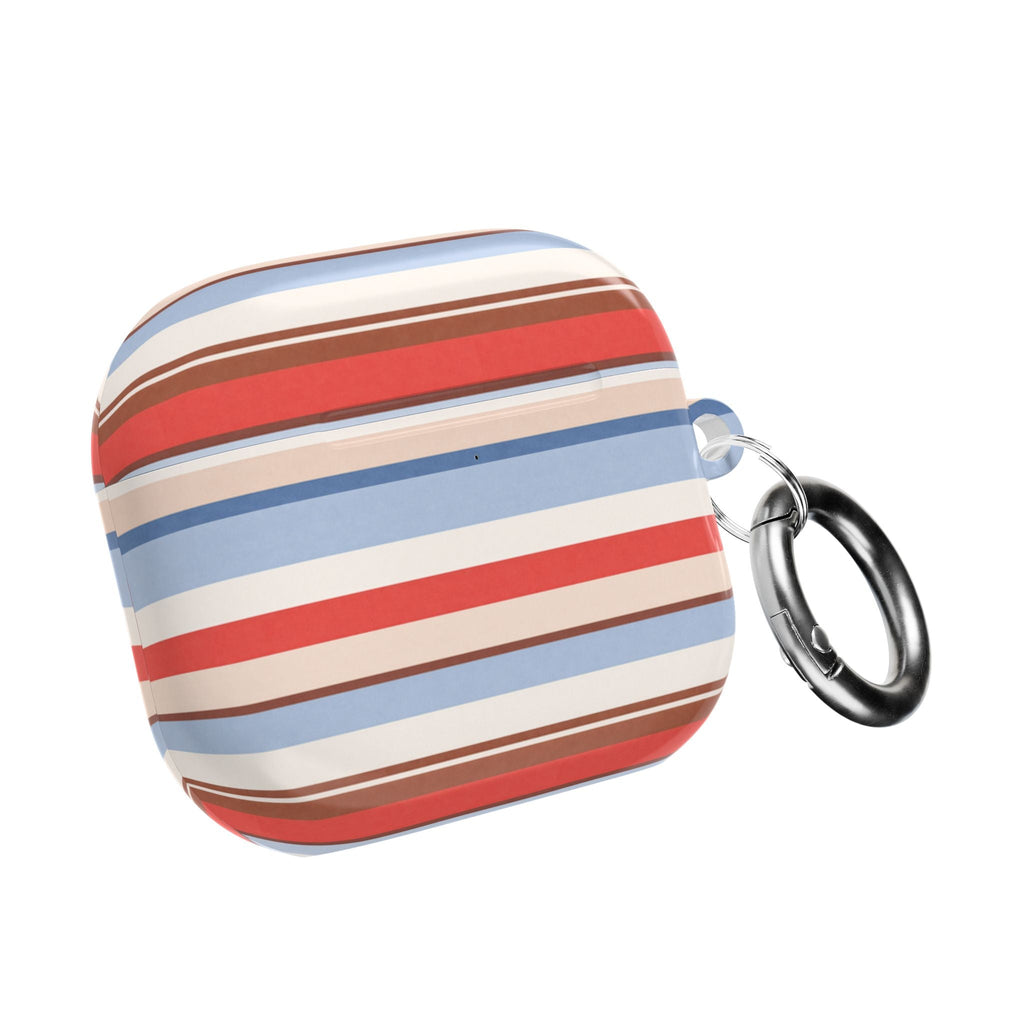 AirPods case with blue, red, and beige horizontal stripes and metal key ring