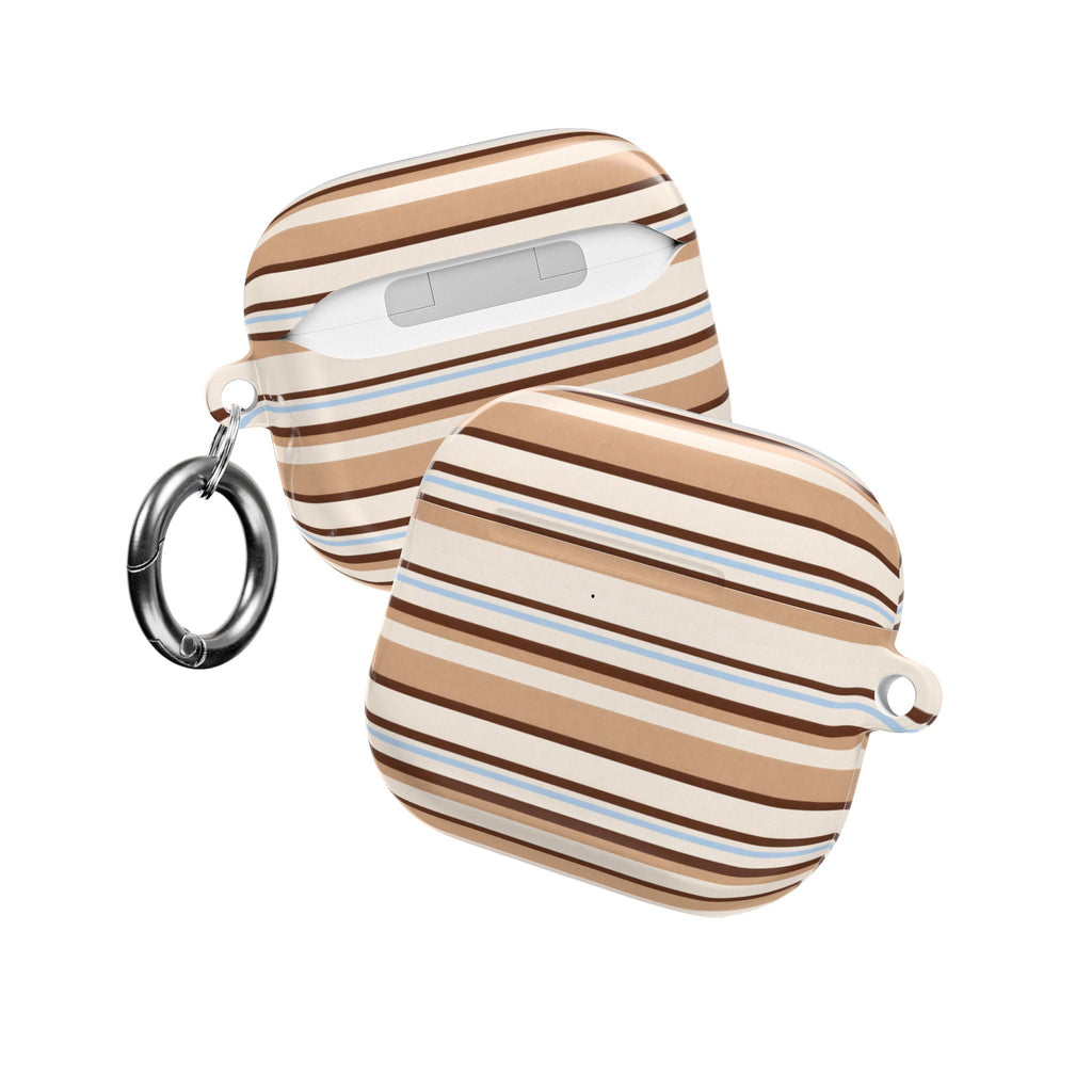 Strap-style AirPods case with horizontal stripes and metal keyrings on both sides.