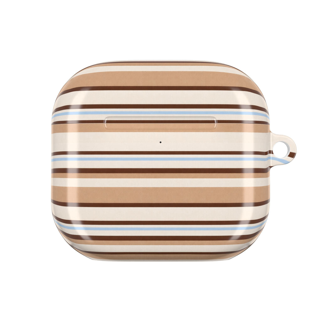 AirPods case close-up in tan, white, and blue horizontal stripes with top button cutout.