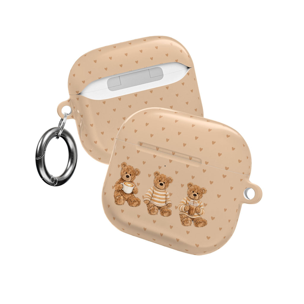 Beige AirPods case with hearts and teddy bears; side view with key ring