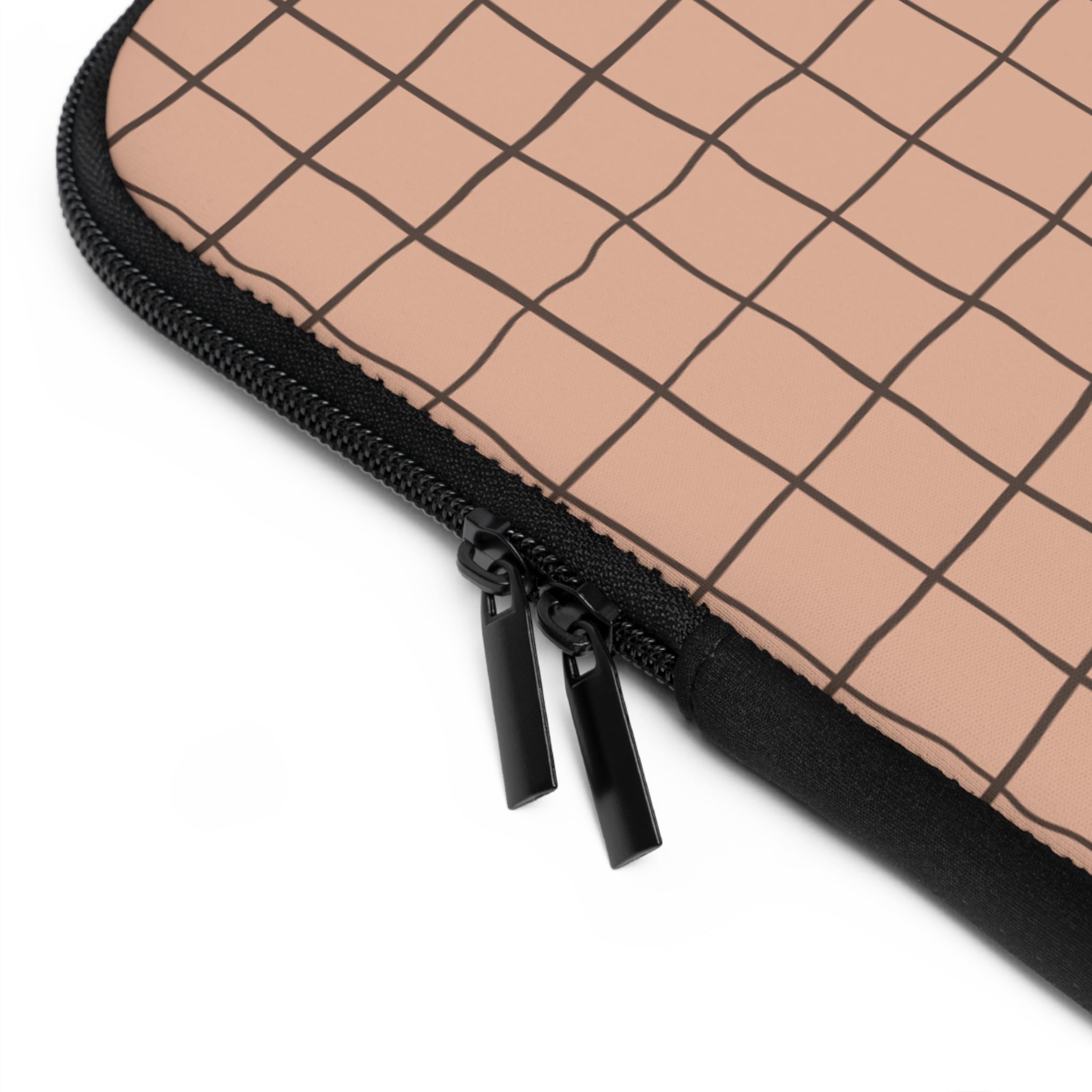 Black zipper pull and track on cappuccino grid neoprene sleeve
