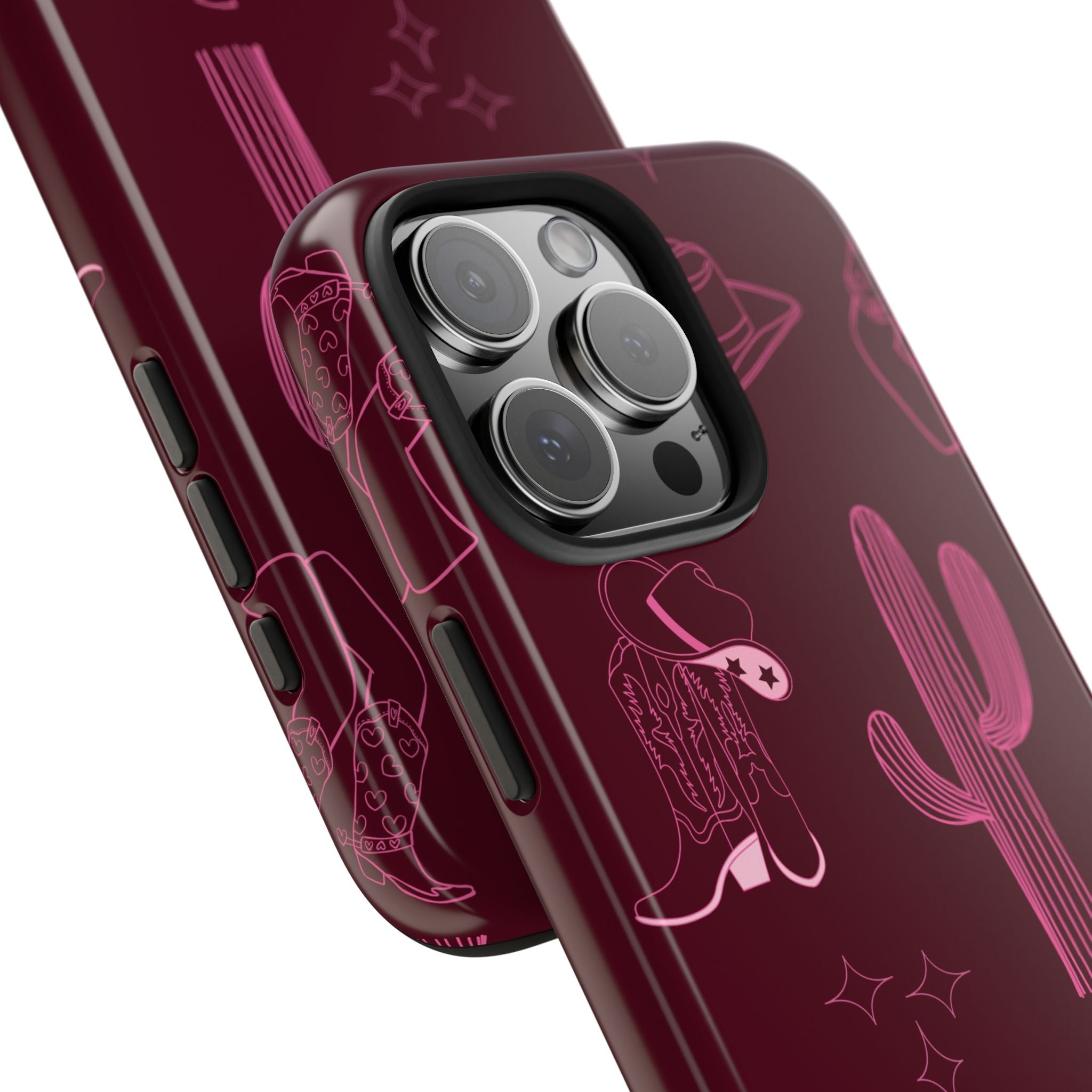 Close-up cherry red phone case corner: camera cutouts and cactus/hat line art