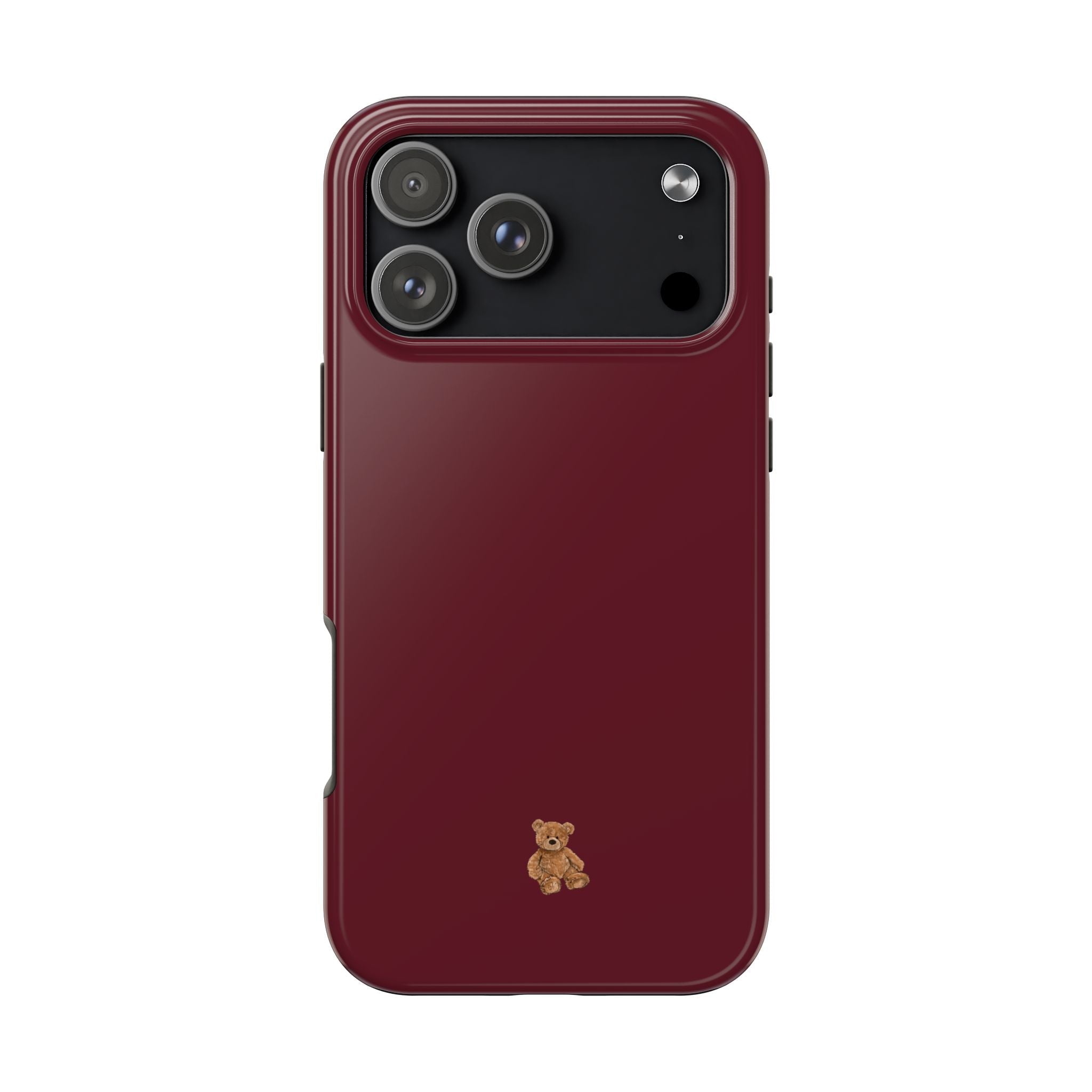 Cherry red phone case with mini teddy bear charm; raised camera cutouts