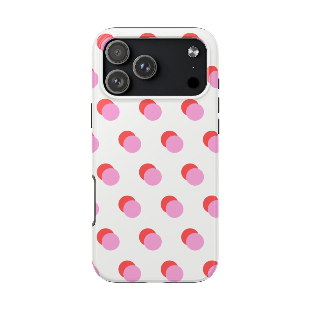 White phone case with pink and red polka dots and camera cutouts