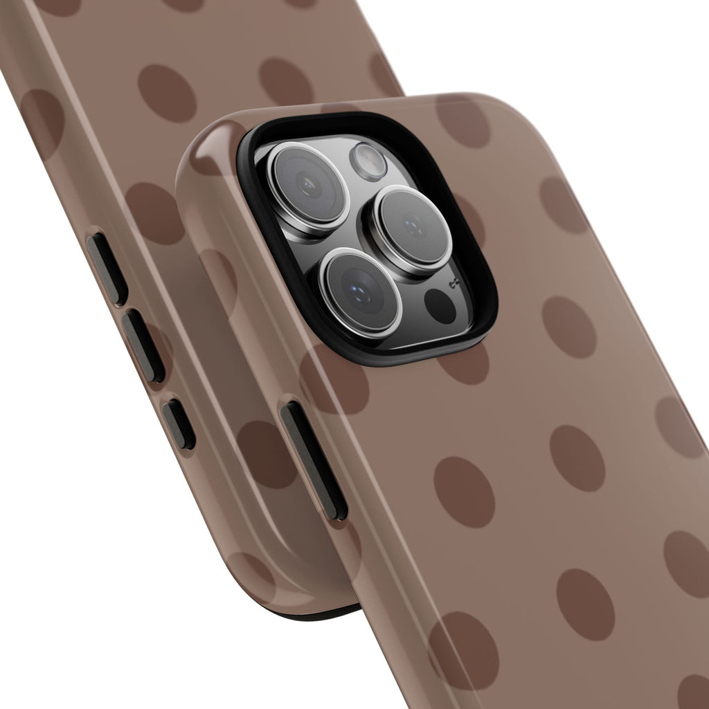 Chocolate polka dot phone case close-up showing camera lenses and cutouts
