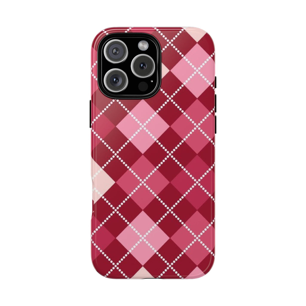 Red and pink argyle phone case with white diamond dots, raised camera frame