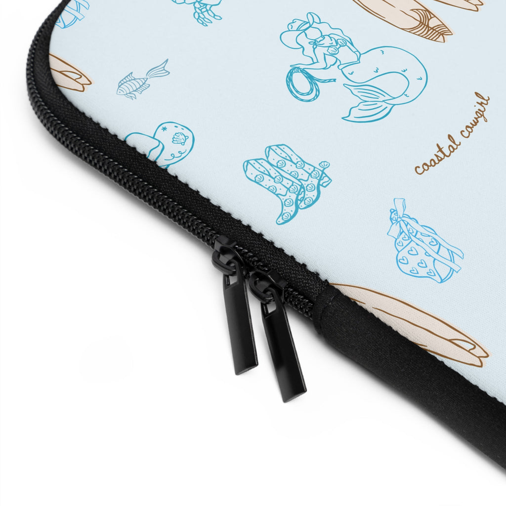 Close-up of black zipper on coastal cowgirl neoprene sleeve with printed pattern