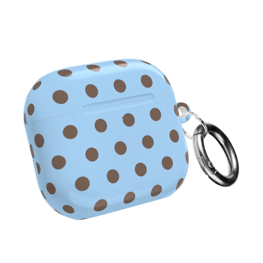 Blue AirPods case with brown polka dots and metal key ring, closed