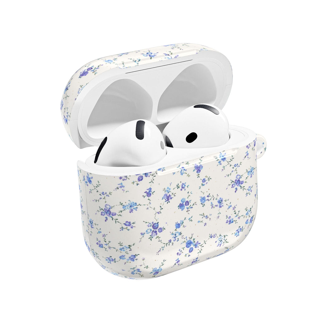 Ditsy blue floral AirPods case with lid open, earbuds inside, white shell