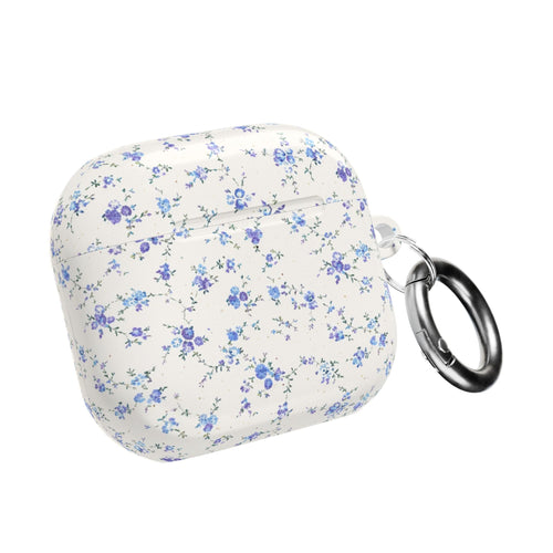 Blue ditsy floral AirPods case closed with metal key ring loop on side, white base